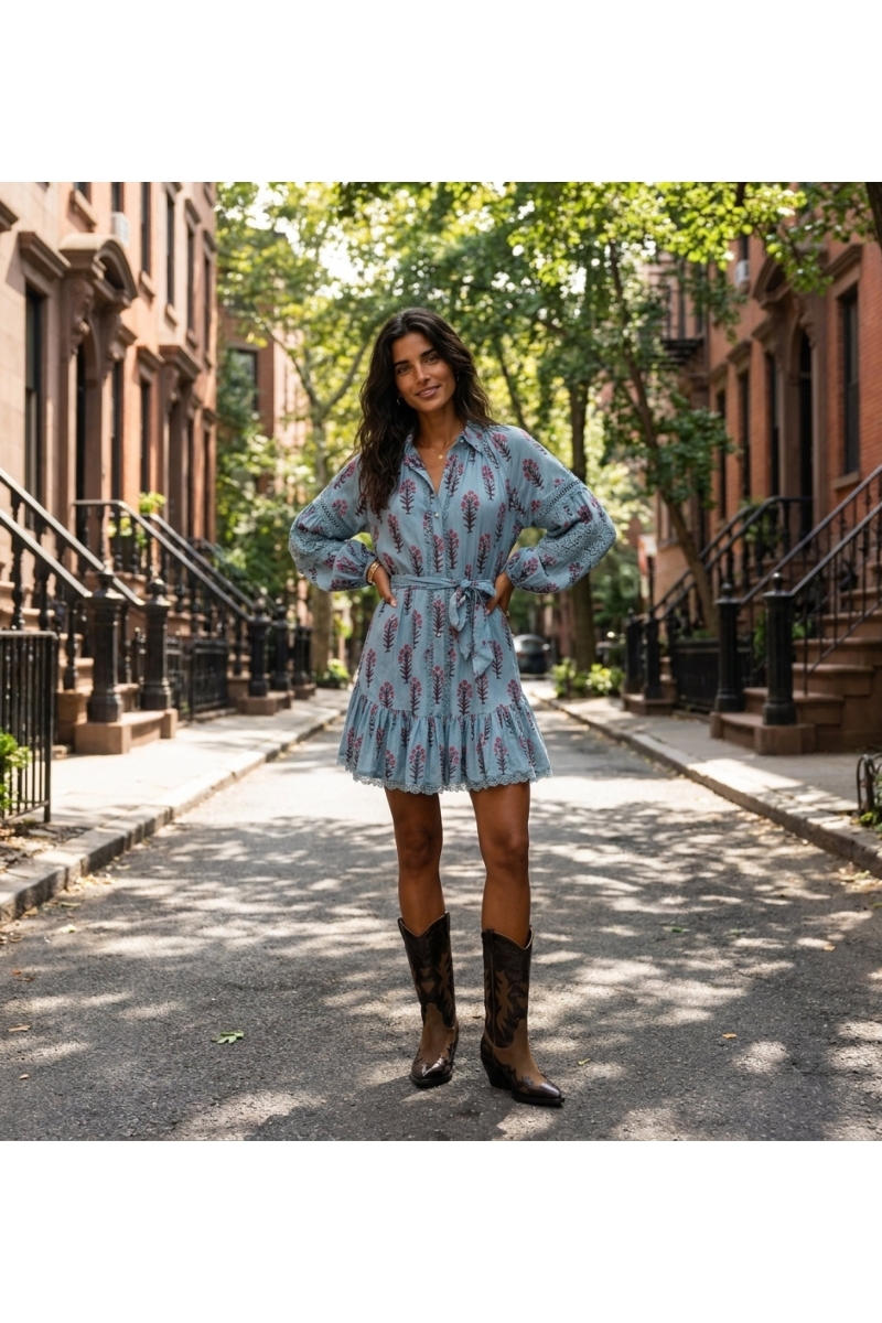 Light blue floral mini dress with long balloon sleeves, lace trim, button-down front, and tied waist.