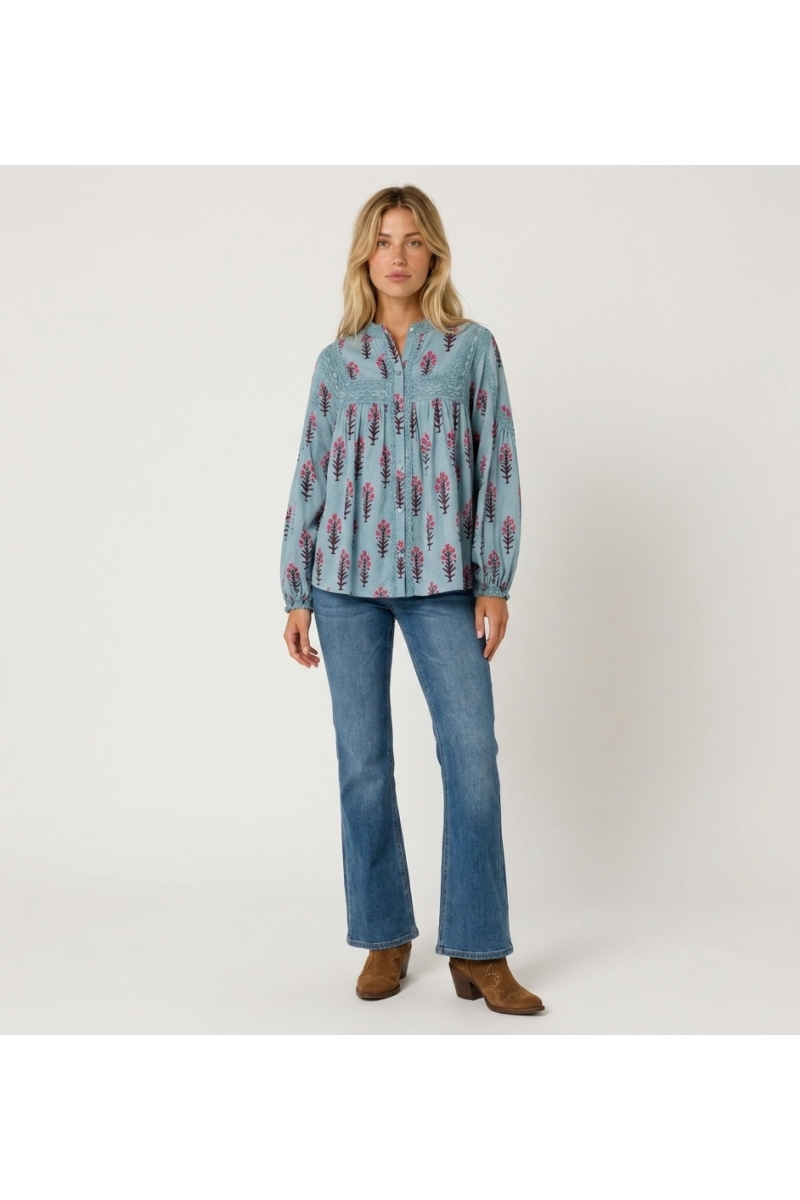 Light blue long-sleeve peasant blouse with pink and brown floral pattern, lace trim, relaxed fit, cotton fabric, front view.