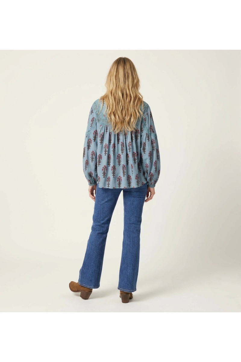 Light blue peasant blouse with pink floral pattern, lace trim, long sleeves, relaxed fit, cotton-feel fabric, back view.