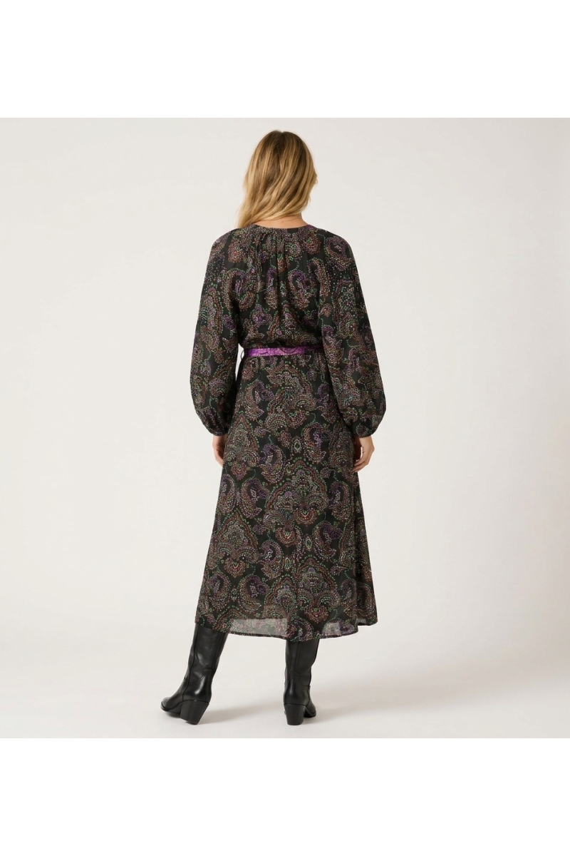 Back view: Black sheer midi dress with colorful paisley, long balloon sleeves, tie-belt with tassels.