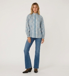 Front view of a light blue long-sleeve blouse with white paisley pattern, high collar, button-down front, and ruffled cuffs.