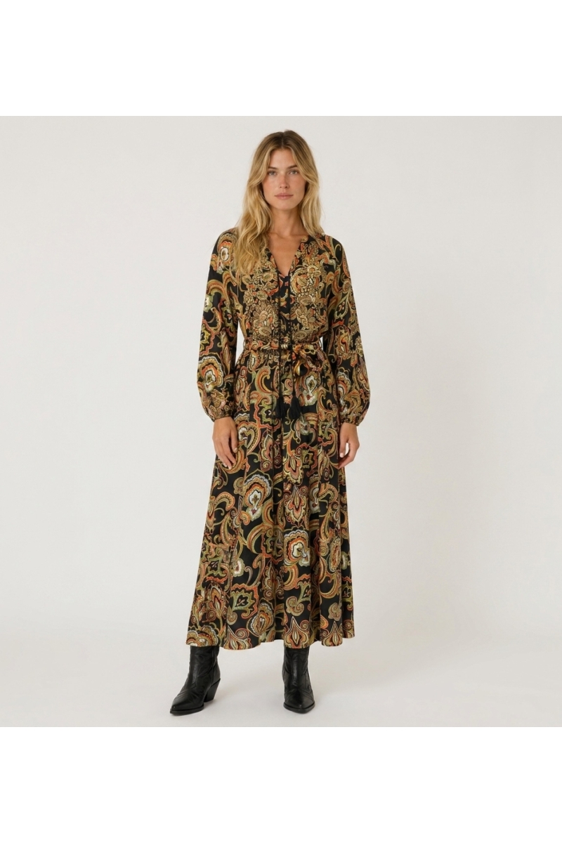 Front view of a black long-sleeve V-neck maxi dress with colorful paisley pattern, tie-waist, and flowing fabric.