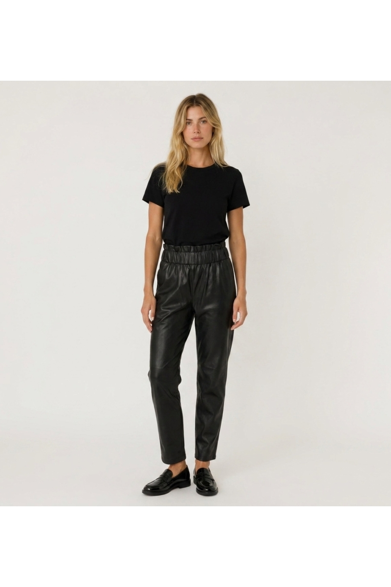 Front view of elegant leather pants. Modern slim fit design, ideal for a sophisticated contemporary style.