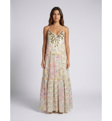Front view: White tiered maxi dress with thin straps, V-neck, and vibrant multicolored floral print. Sequin embellished neckline
