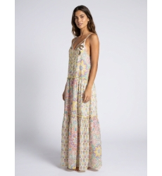 White long tiered maxi dress, thin straps, V-neck with gold/silver sequins, vibrant floral pattern, model side view.