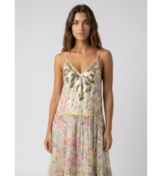 White tiered maxi dress with thin straps, sequined V-neckline, and vibrant multicolored floral print.