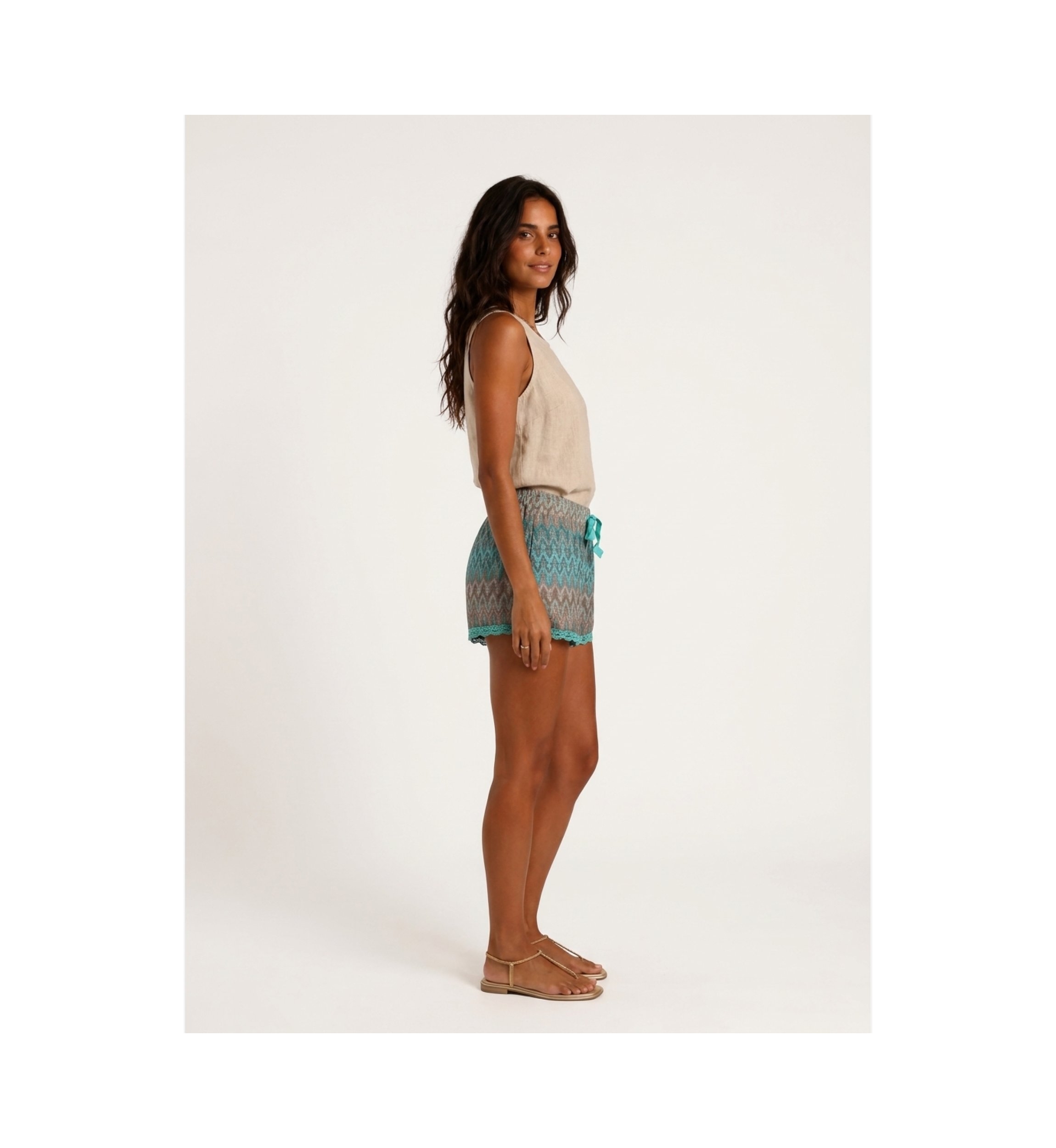 Stylish women's shorts, shown on a model from the left side, perfect for summer fashion.